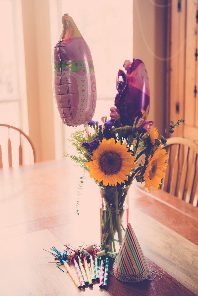 These balloons were in flower arrangements that were sent when Lyla was born, a year ago.  My mom saved them so we could put them out again.  We'll see if they survive to year two!